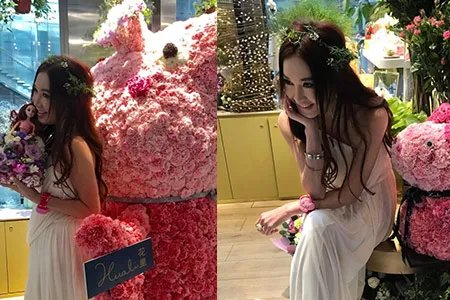 温碧霞开花店晒多张美图 穿红色吊带裙表情惹眼